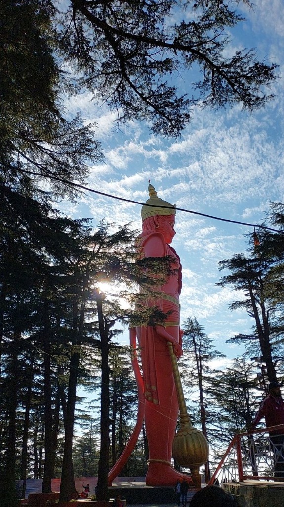 Jakhu Temple 108-feet Hanuman statue surrounded by cedar trees in Shimla